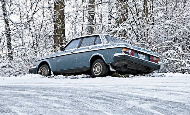 A car sits in the ditch at the corner Northeast 116th Street and 154th Place Northeast near 60 Acres Park. Snow and ice have made for difficult driving conditions. More snow and cold temperatures are predicted today and possibly through tomorrow.