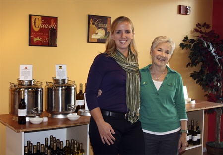 Seattle Olive Oil salesperson Kristin Becker (left) and manager Karen Gosselin (right) invite you to sample the gourmet olive oils and balsamic vinegars offered at the new specialty shop at Redmond Town Center. The versatile and healthy products can be used for salad dressings