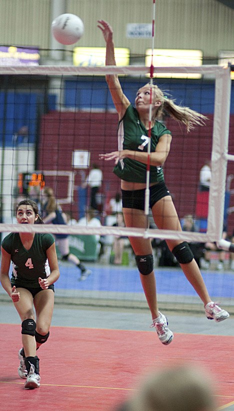 Bear Creek outside hitter Maddie Easley goes up for a kill during the Grizzlies' match against Dayton last Saturday at the 2B state volleyball tournament at the Yakima Sun Dome. Led by Dominique DuBois (No. 4) with 11 kills