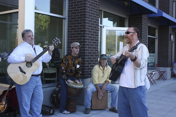 Musicians perform on the corner of Cleveland Street and 161st Avenue Northeast in downtown Redmond as part of the city's Feedback Festival.