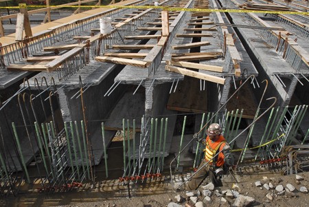 A construction crew member works on setting up rebar for the east side of the bridge deck as part of the City of Redmond's Northeast 36th Street Bridge project in Overlake. Last month