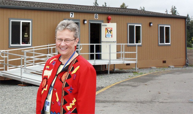 Rosa Parks Elementary school principal Dr. Lin Zurfluh stands in front of one of four portables on school grounds. Rosa Parks Elementary in the Redmond Ridge development was built for 500 students. In its fifth year