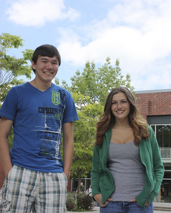 Redmond High School seniors Cameron Akker and Jazmin Diebler hang out in the school’s quad. The Mustang graduation ceremony is at 2 p.m. Monday at KeyArena.