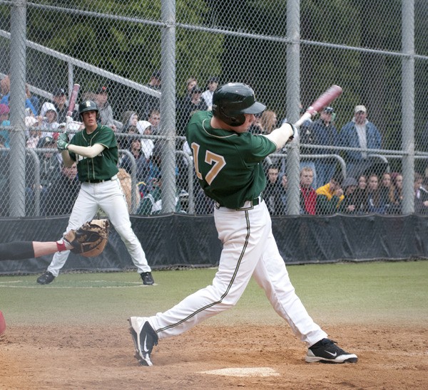 Redmond junior Peter Hendron blasts a two-run home run out of Hartman Park during the Mustangs 10-0 rout of Marysville-Pilchuck that earned them a state tournament berth on Monday. Hendron