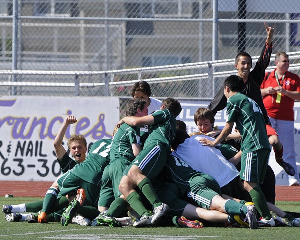 The Overlake boys' soccer team celebrates after beating Chelan