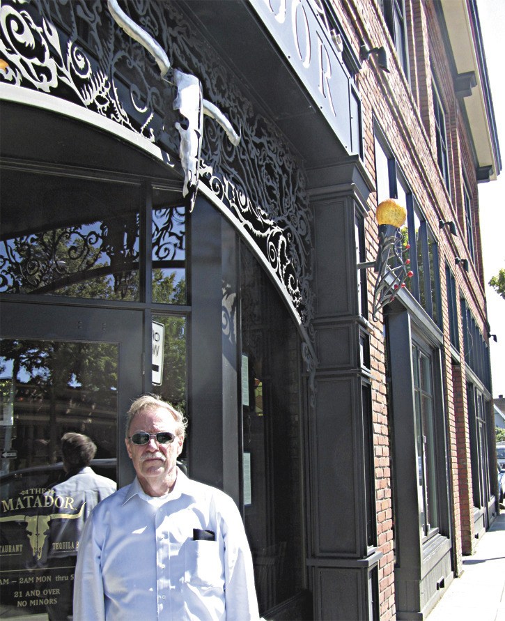 Tom Hitzroth stands in front of the historic Brown Building