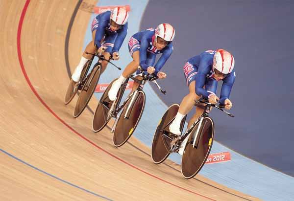 Jennie Reed leads Dotsie Bausch and Sarah Hammer in the preliminaries of the Women's Team Pursuit at the London 2012 Olympics.