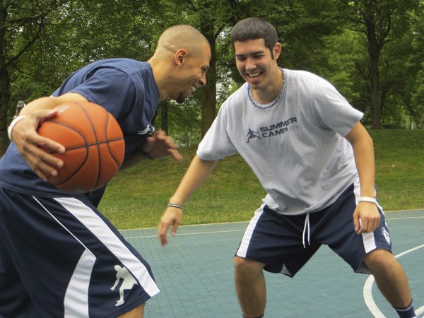 Kyle Keyes (left) and Jon Kaneshiro play one-on-one at Grass Lawn Park in Redmond