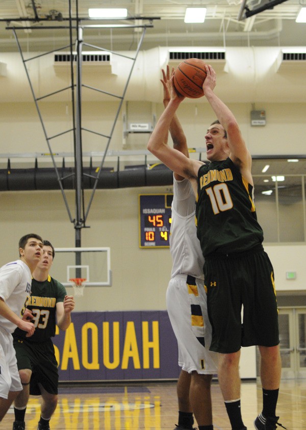 Redmond senior forward Jason Harrington goes up for two of his game-high 21 points on Wednesday night against Issaquah