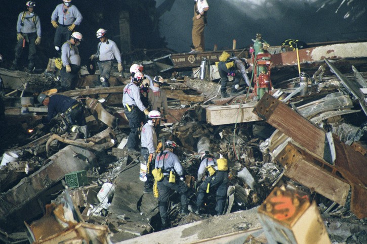 Firefighters scour the rubble for people following the terrorist attacks of Sept. 11