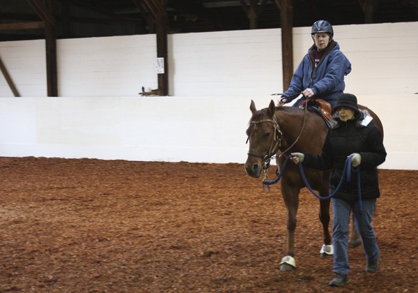 Karol Flynn (on Skip the horse) was one of two riders to make the first rides at the new Little Bit Therapeutic Riding Center at Dunmire Stables in Redmond on Tuesday.