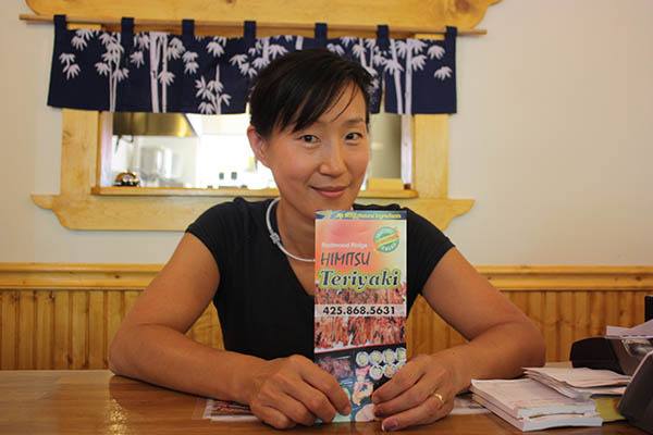 Sue Lee stands behind the counter at the remodeled Himitsu Teriyaki.