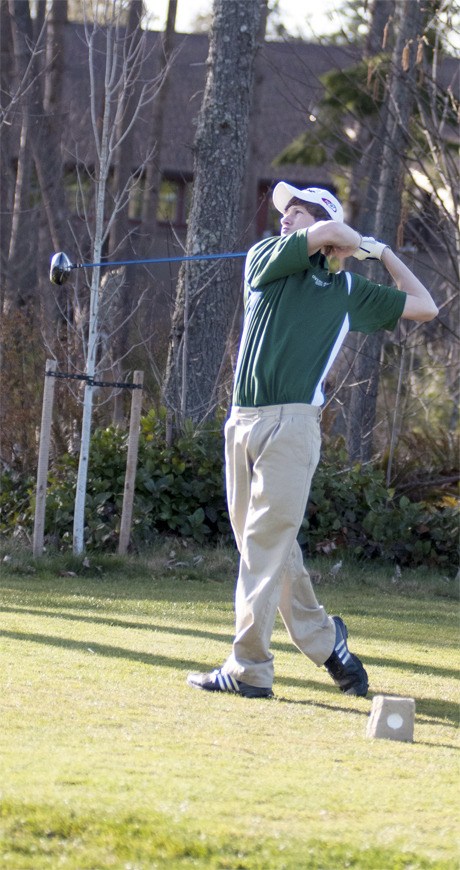 Overlake School junior Reid Fredrickson tees off during a practice round at The Golf Club at Redmond Ridge on Wednesday. Fredrickson