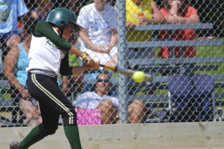 Redmond High School senior Maria Reisinger takes a swing at the ball during the Mustangs' 4-2 loss against Walla Walla during last weekend's Class 4A state tournament in Tacoma.