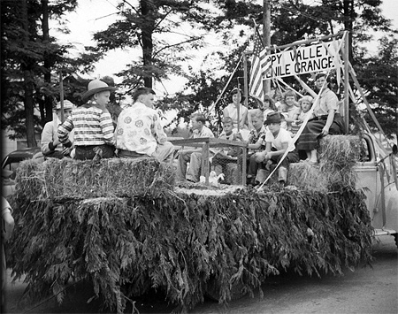 Youths enjoy the ride on the Happy Valley Juvenile Grange float during a parade near Redmond in 1954. The Redmond Happy Valley Grange will celebrate 100 years of community service as one of the oldest organizations in the Redmond area