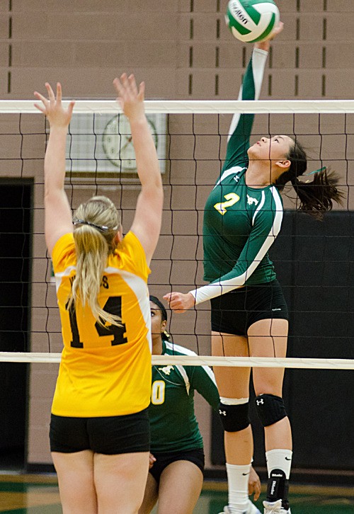 Redmond outside hitter Joy Zhang goes up for a kill during the Mustangs' 3-0 loss to Inglemoor on Tuesday night. Zhang and fellow senior Heather Smith led the team offensively with six kills each.