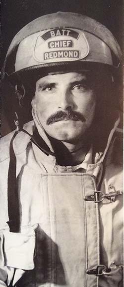 Former Redmond Fire Battalion Chief Ed Carolan during his earlier days with the department. This was one of many photos shown at Carolan's retirement party last month and a particular favorite among the crowd.