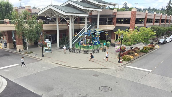 There is a fence around the Sensory Garden at Redmond Town Center but no other barrier closer to the road.
