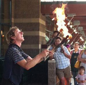 Justin Therrien performs fire juggling for the crowd during last Saturday's Whole Kids Foundation Celebration Carnival at Whole Foods Market in Redmond. The event raised funds for the Whole Kids Foundation