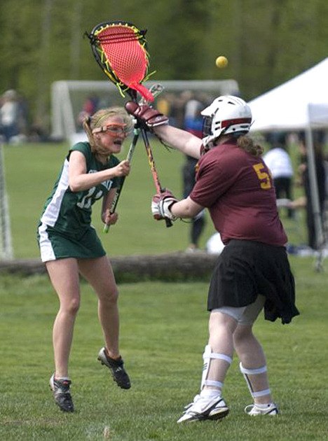 U15 player Mariel Frank (left) of The Overlake School fires a shot on goal during the Washington Schoolgirls Lacrosse Association's jamboree at Marymoor Park last weekend. Over 800 girls attended the event