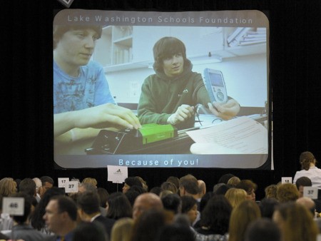 Remond Jr. High School science students display a LabQuest unit during a video presentation during the annual Lake Washington Schools Foundation luncheon at the Juanita Field House in Kirkland on Wednesday.