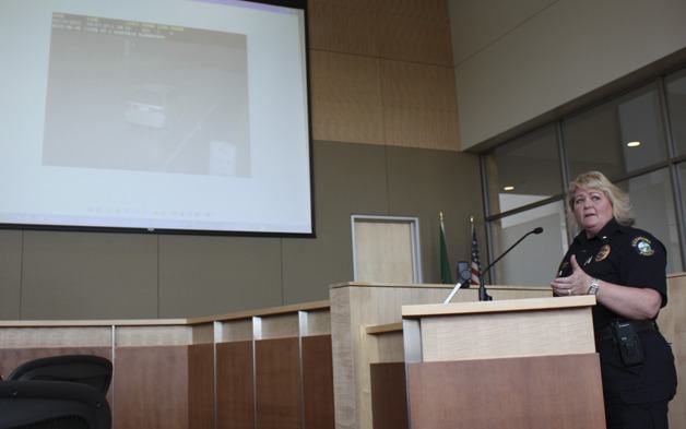 Redmond Police Commander Shari Shovlin gives a presentation to public safety committee members Tuesday evening to clarify how officers decide whether to issue a citation using its new camera enforcement program.