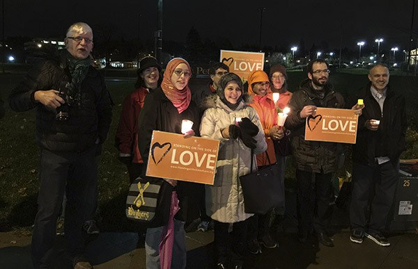 People of all backgrounds gathered along Central Way in Kirkland for an inter-faith peace vigil in support of Syrian refugees.