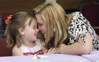 Gretchen MacKenzie giggles with her daughter Hadley