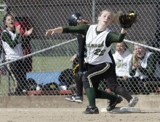 TOP: Redmond’s Emily Squiers (No. 22) and the Mustangs shocked the state field