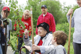 Friends at RedWood Family Church celebrated Waneta Shawhan’s 98th birthday last week with a tree planting party at Perrigo Community Park.  From left