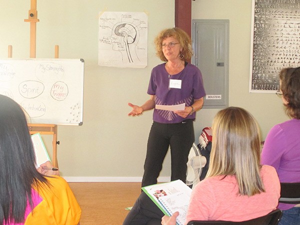 Mental health therapist Lynn Tienken leads a parenting workshop for mothers at Health Within in Redmond.