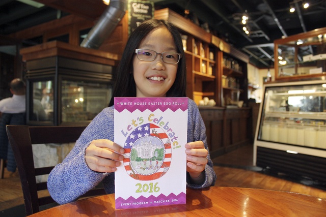 Redmond 10-year-old Felicity Ng displays her artwork that was used on the White House Easter Egg Roll program. Samantha Pak