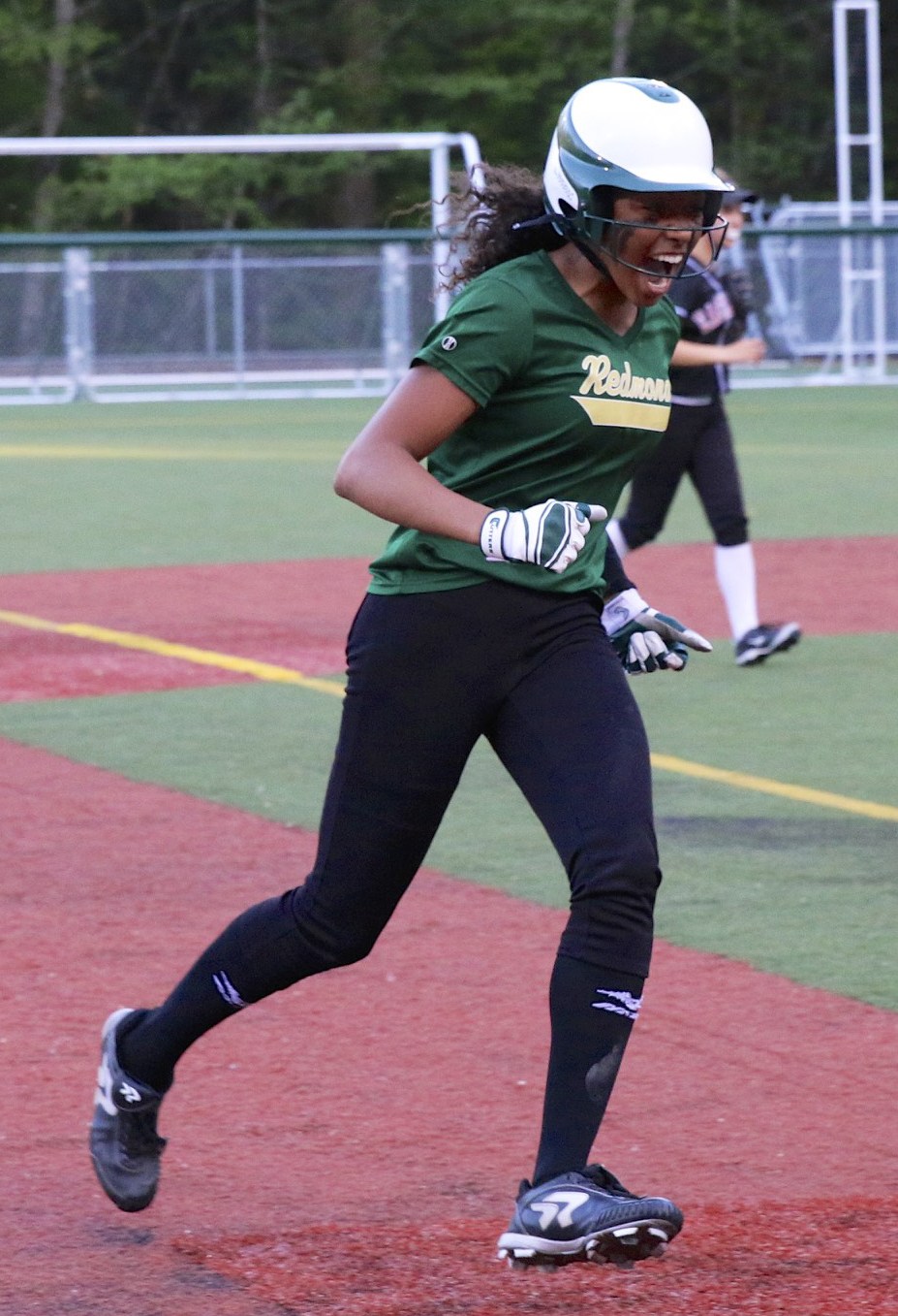 Redmond’s Kiki Milloy is ecstatic while running the bases after hitting a home run. Courtesy of Kristen Gibson