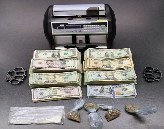 Some of the items recovered during a task force raid. Photo courtesy of the Eastside Narcotics Task Force.