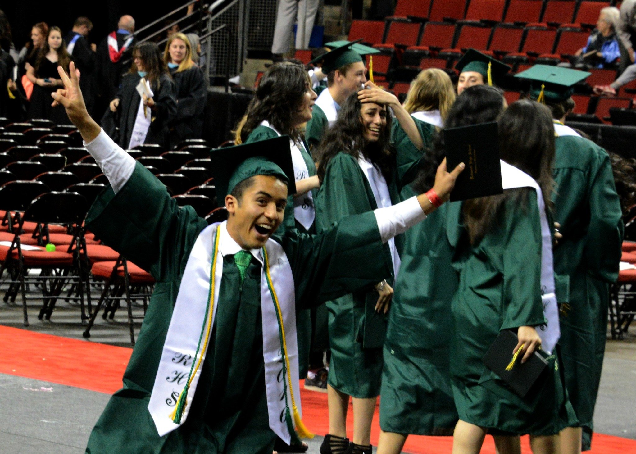 Redmond High graduate Jacob Montiel-Bravo celebrates after tonight’s commencement at KeyArena in Seattle. Andy Nystrom