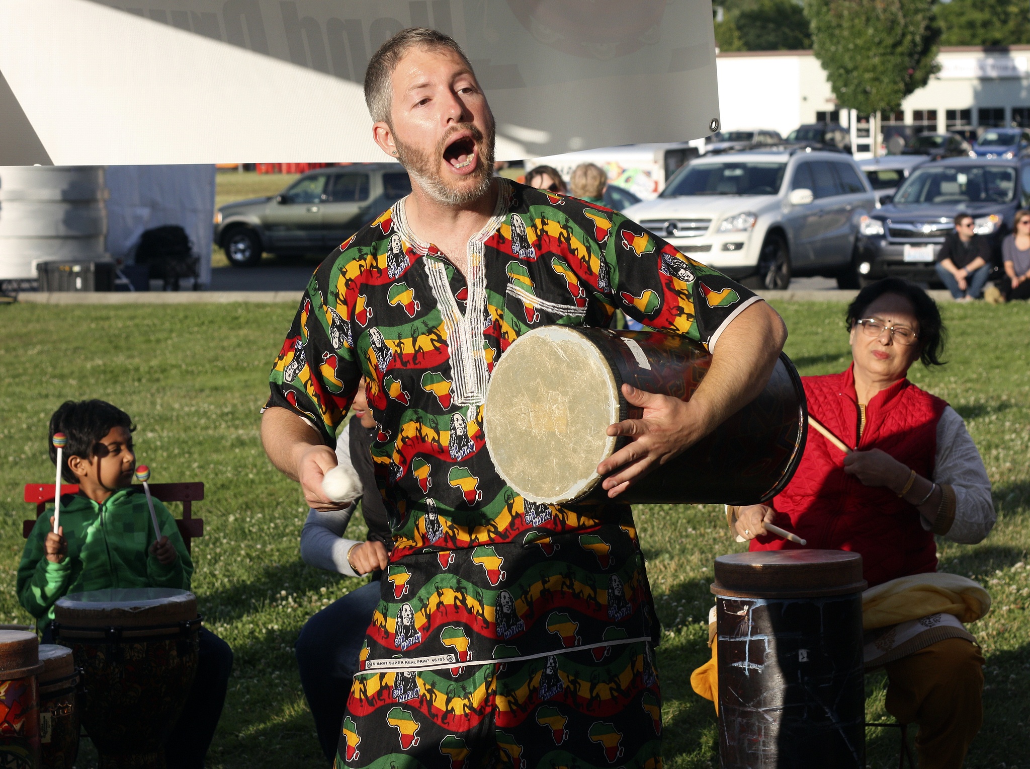 Seattle Hand Drummers’ Na’tan Collins leads a workshop on Tuesday evening at Redmond Make Music Day at Downtown Park. Andy Nystrom