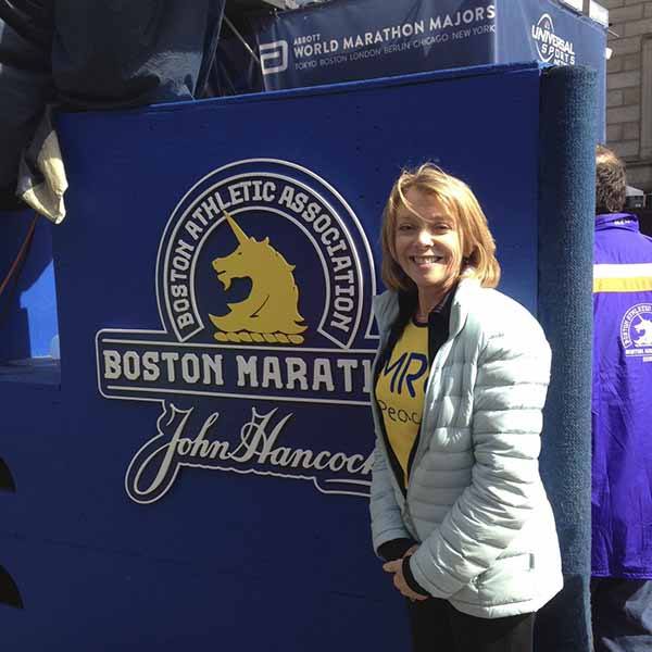 Redmond’s Rosemary O’Connell stands near the finish line of Monday’s Boston Marathon.