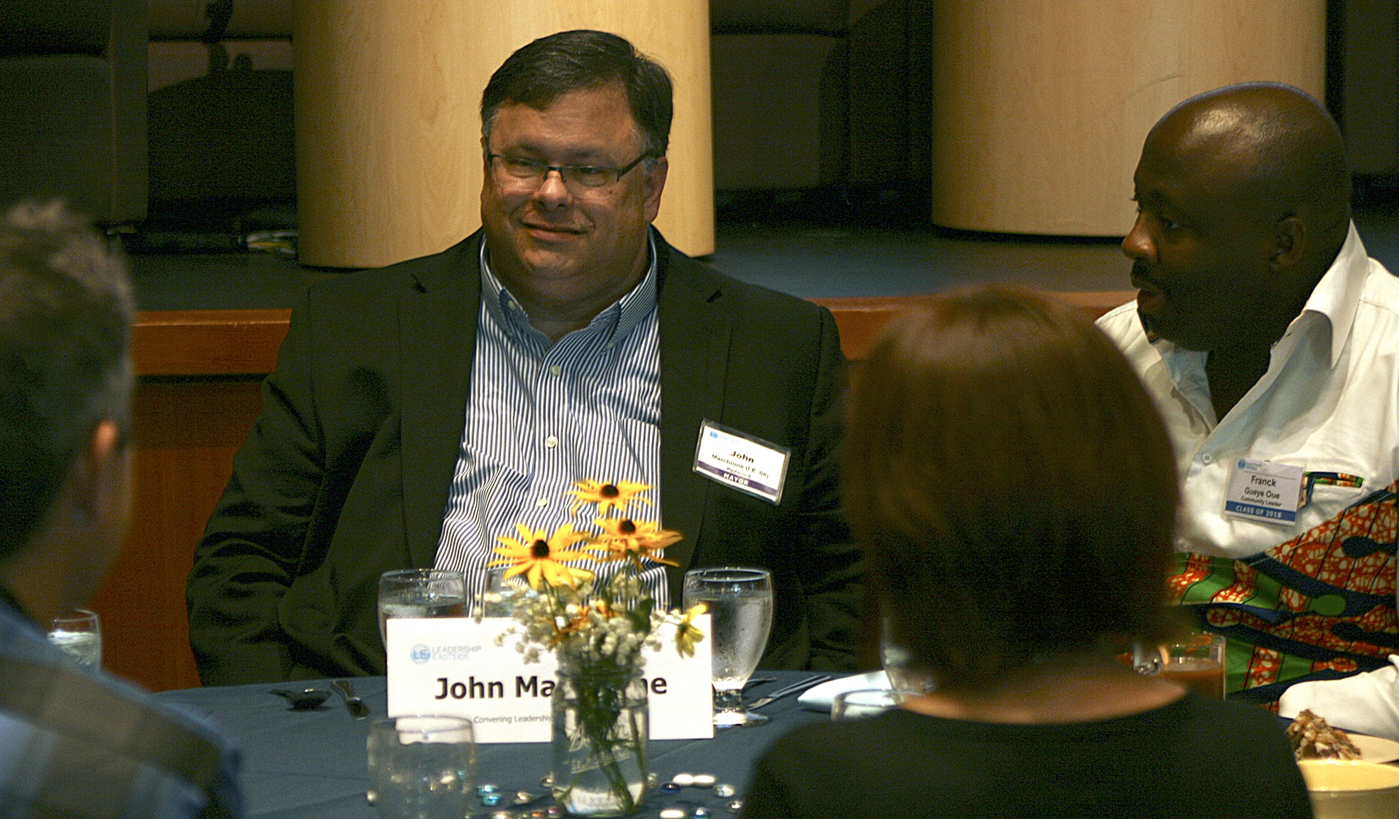 Redmond Mayor John Marchione visits with attendees at the Leadership Eastside mayors’ panel on Sept. 9 at Cascadia College in Bothell. Catherine Krummey