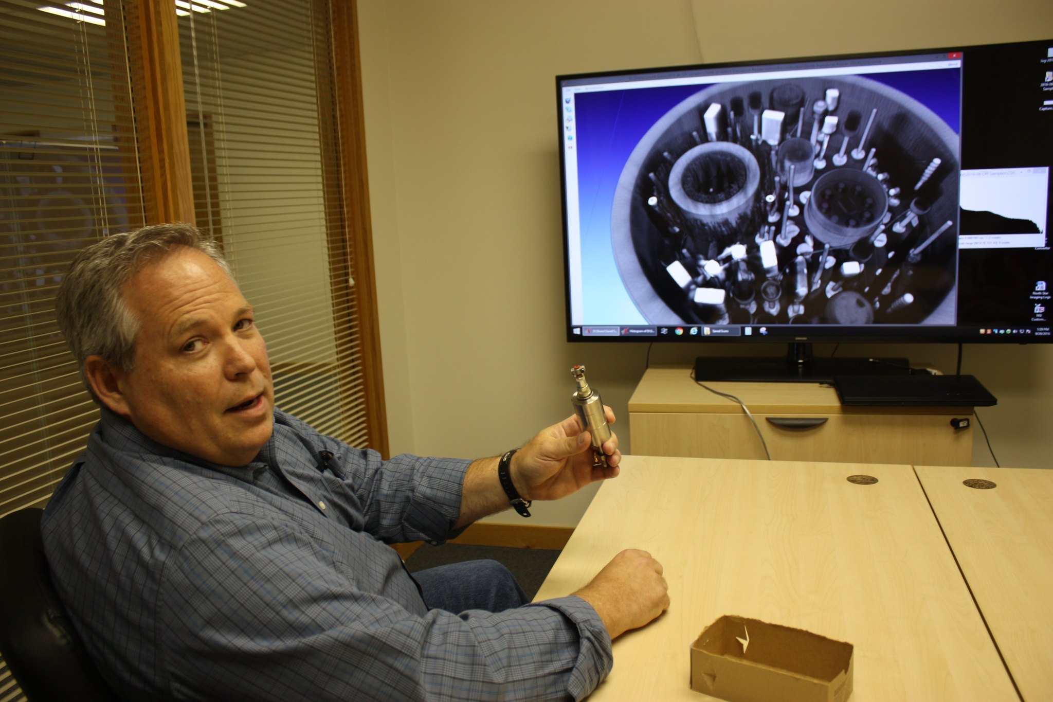 Delphi Precision Imaging owner Blake Chenevert displays a 3-D X-ray on the screen of a pressure transducer that he’s holding. The Redmond company has been in existence for five months. Samantha Pak