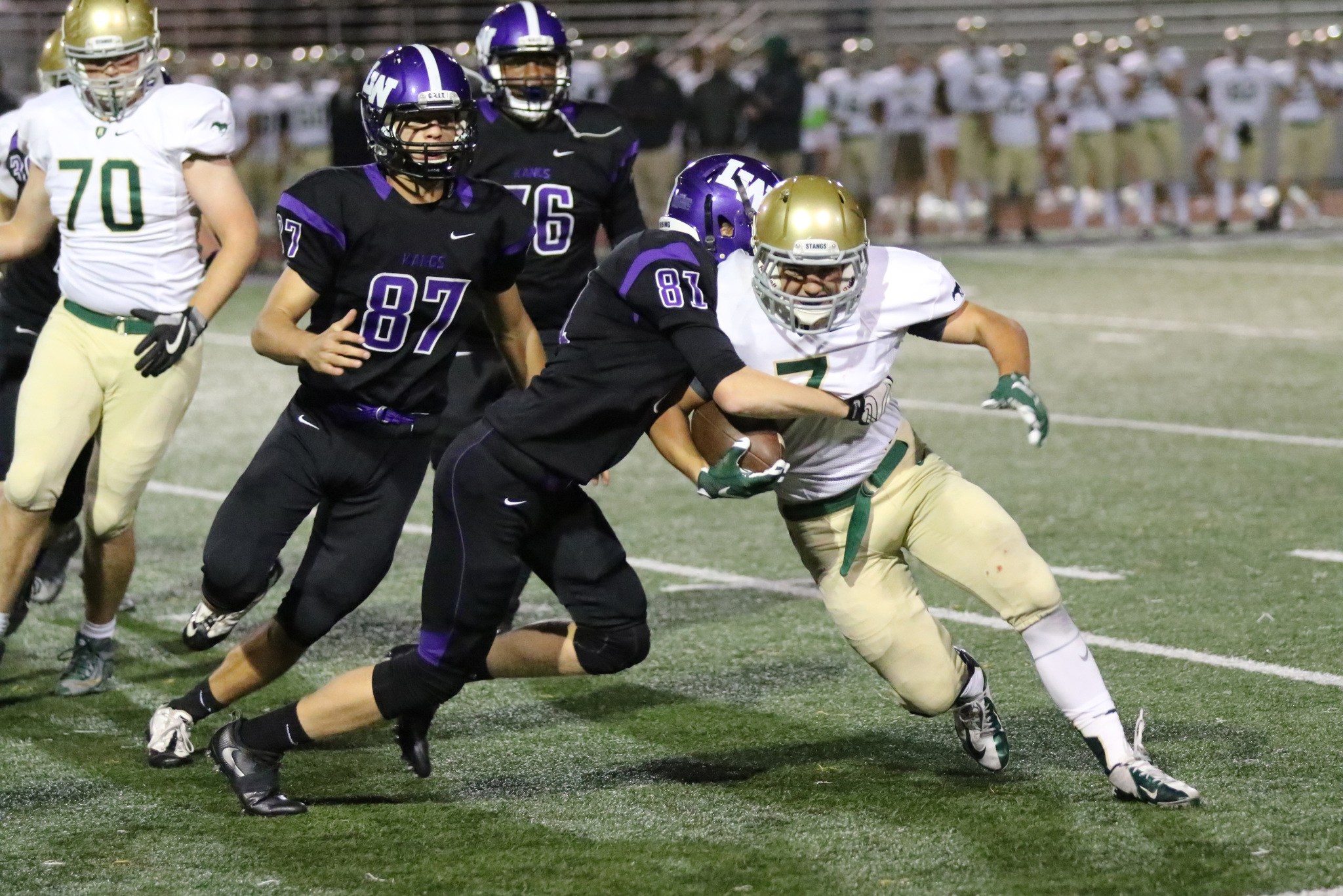 Lake Washington junior safety Sam Showalter (81) tackles Redmond running back Joel Hargin during the first half of Friday’s loss at Mac Field. Photo courtesy of Willie Paine.
