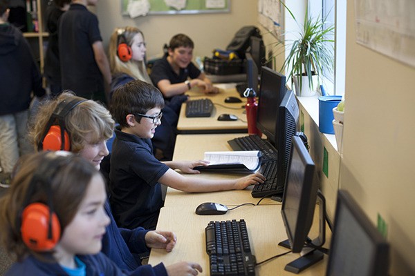 Students practice computer exercises at Eaton Arrowsmith Academy. The schools first opened in Canada but this fall
