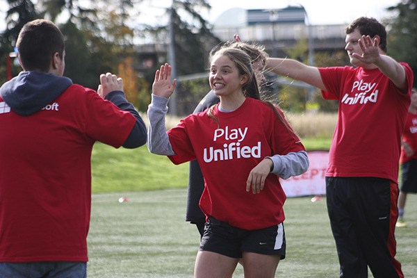 Microsoft and Special Olympics players enjoy Monday's soccer match.