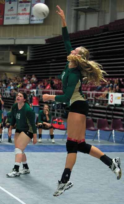 The Bear Creek School’s Makena Schoene slams away as Michele Brown watches at last Friday’s Sundome Volleyball Festival. The Grizzlies tied for third with Lynden Christian.