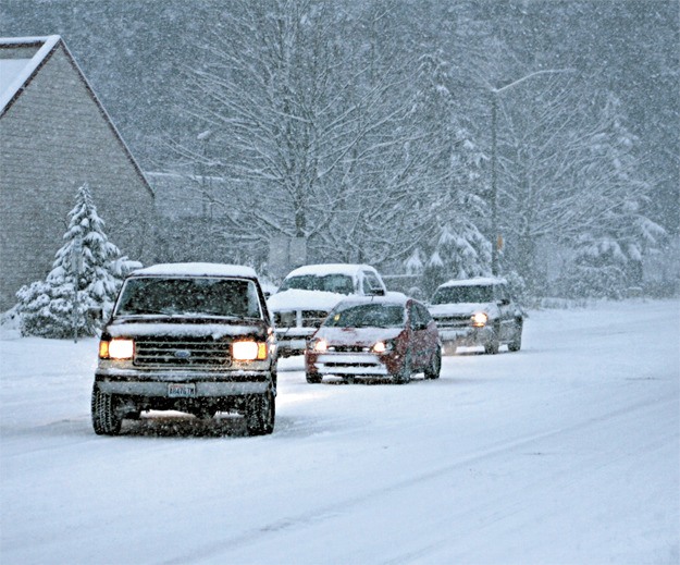 Consider adding weight to the back of your truck to help navigate icy road conditions. Redmond was hit with more than a foot of snow in December of 2008.