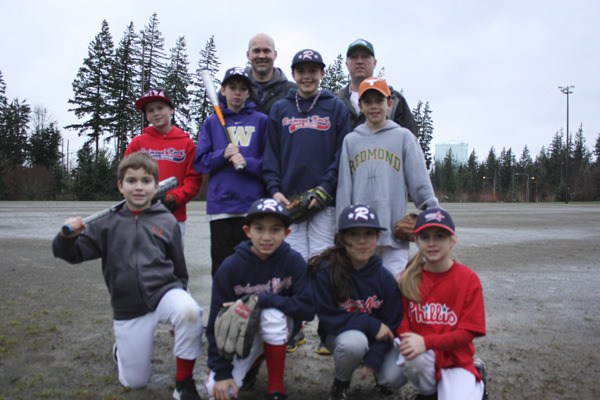 Redmond North Little League is leading an effort to raise money to renovate the fields at Redmond Ridge Park. From left