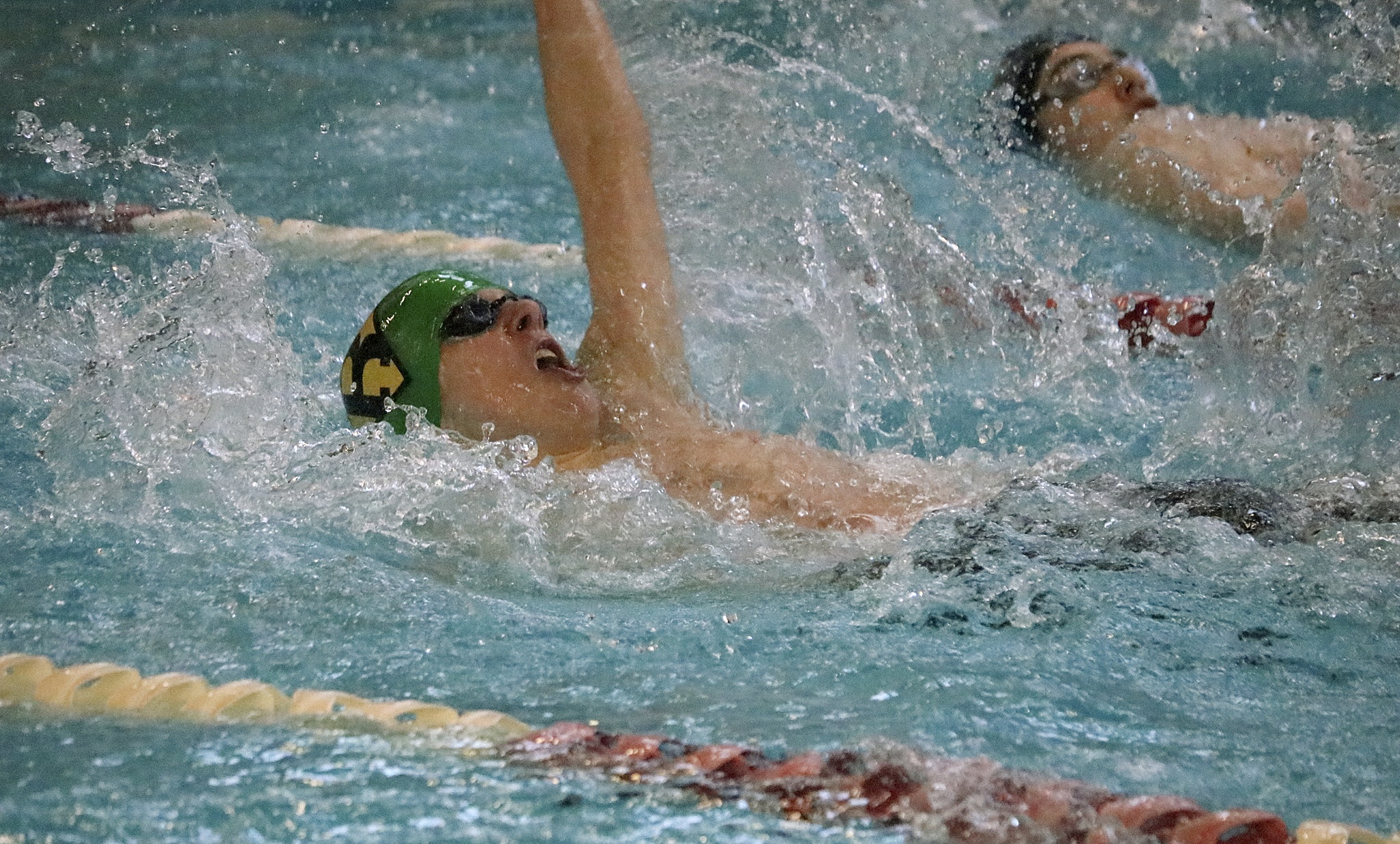 Redmond’s Peter Fitch competes in the 100-yard backstroke during the 3A SeaKing boys swim and dive district championships Saturday at Mary Wayte Pool. Fitch placed 11th overall in the event with a state-qualifying time of 56.99 Joe Livarchik/staff photo