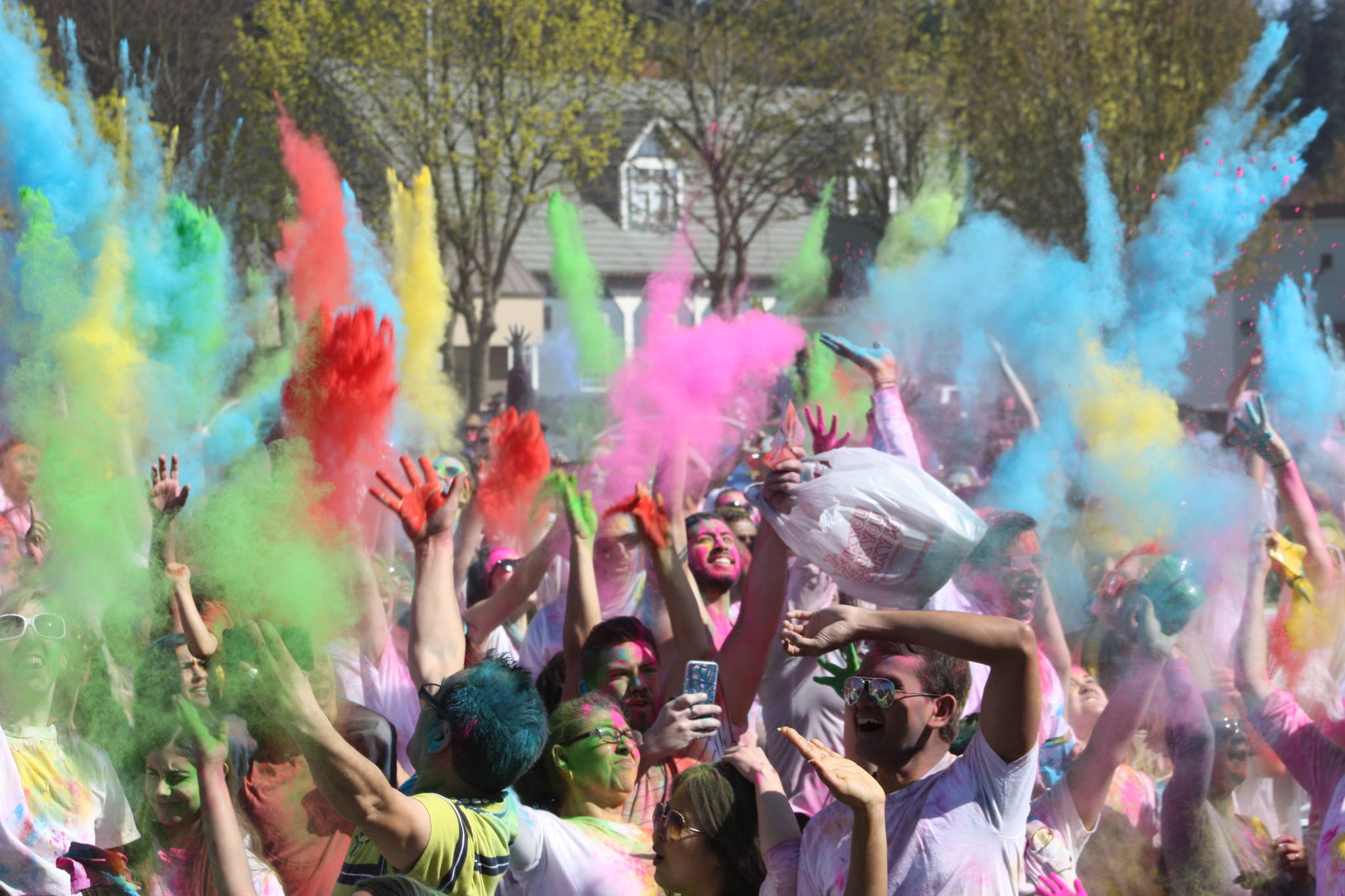 Colors fly as people enjoy last year’s Holi festival in Redmond. Reporter file photo
