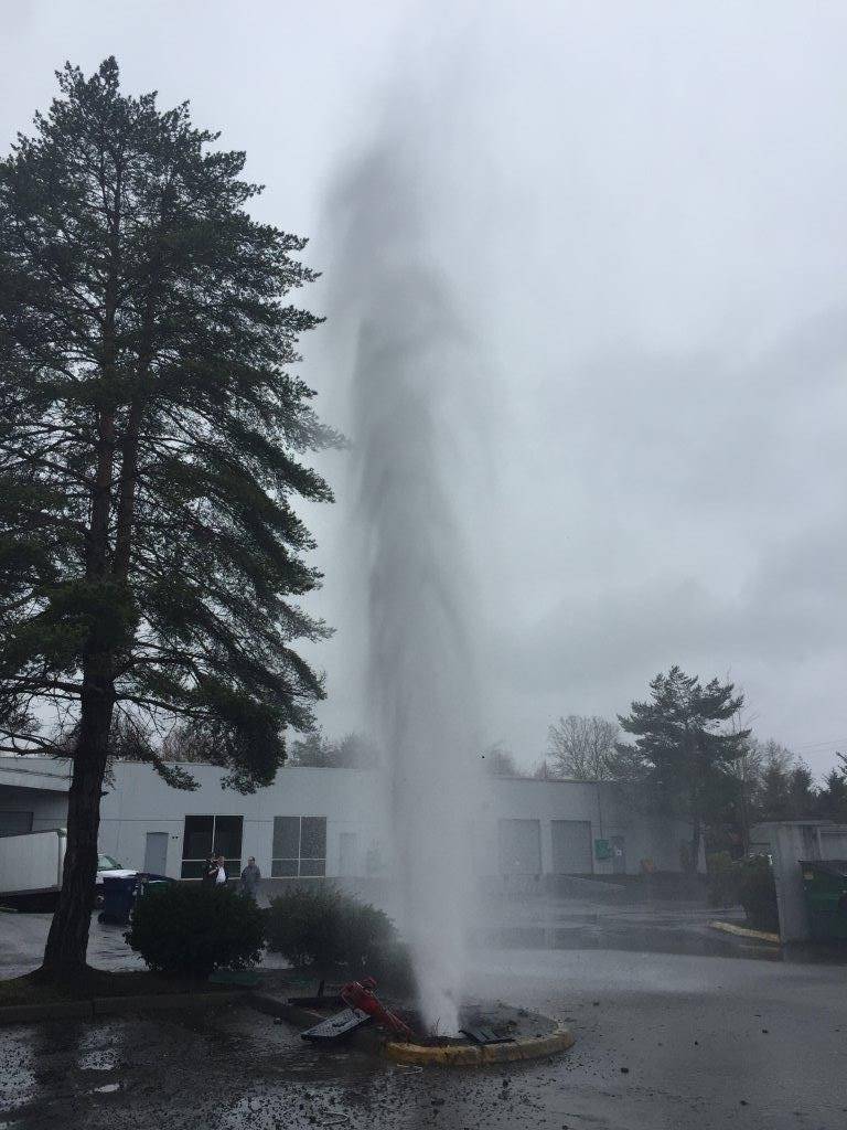 The water has been capped and repairs are underway on this hydrant that was struck by a car this afternoon. Courtesy of the Redmond Police Department