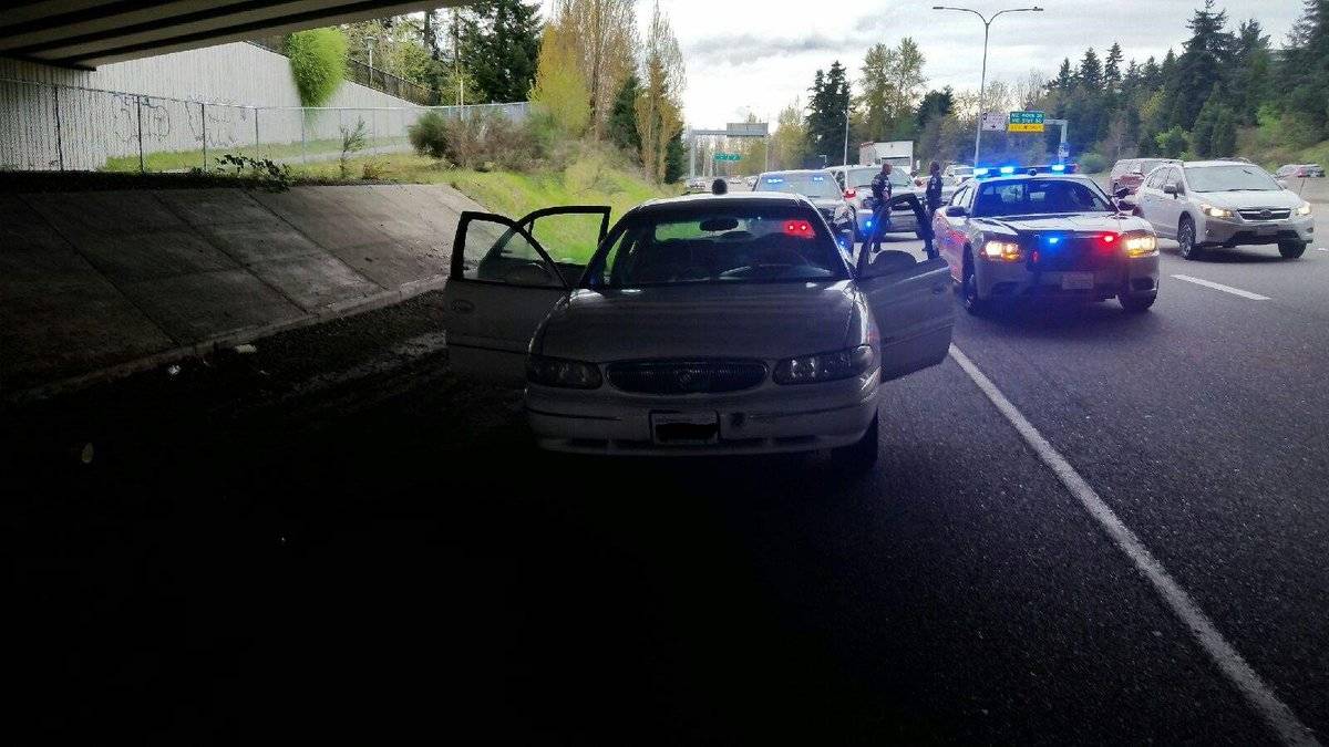 Redmond police officers on the scene after taking three robbery suspects into custody on State Route 520 this afternoon. Courtesy of the Redmond Police Department