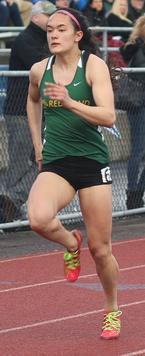 Redmond High senior Tessa Fujisaki runs to victory in the 100 meters on April 13 at Juanita High. She won in 12.57. This season, she is ranked third in 3A state in the 200 meters (25.79) and sixth in the 100 meters (12.54). Andy Nystrom, Redmond Reporter